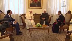 Image may contain: one or more people, people sitting and indoor